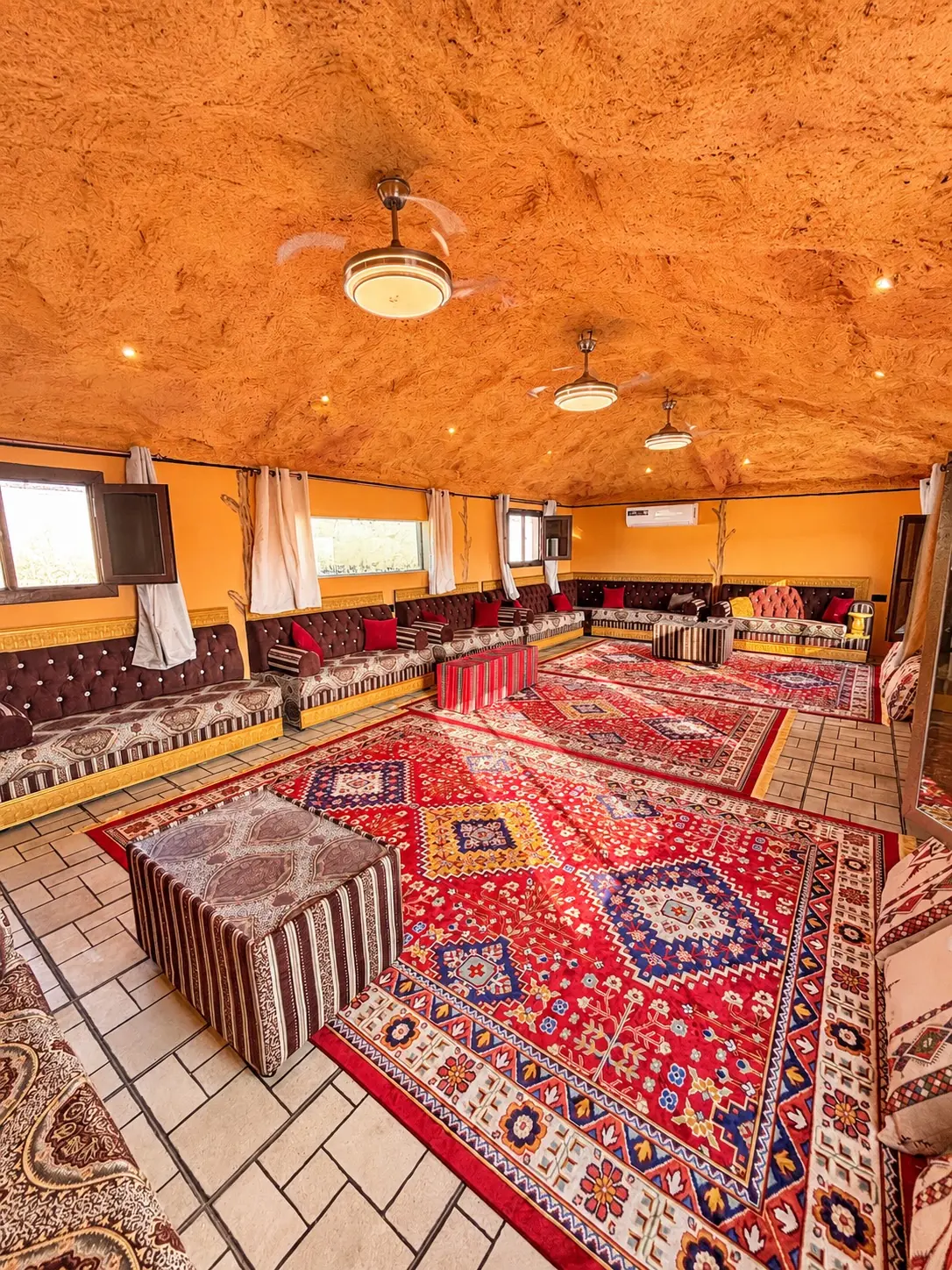 Floor seating and patterned carpets in the majlis