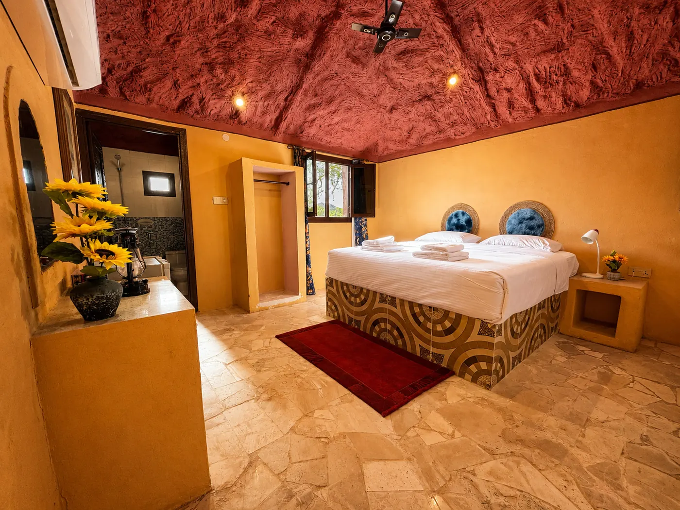 King bed, painted ceiling and a mountain window