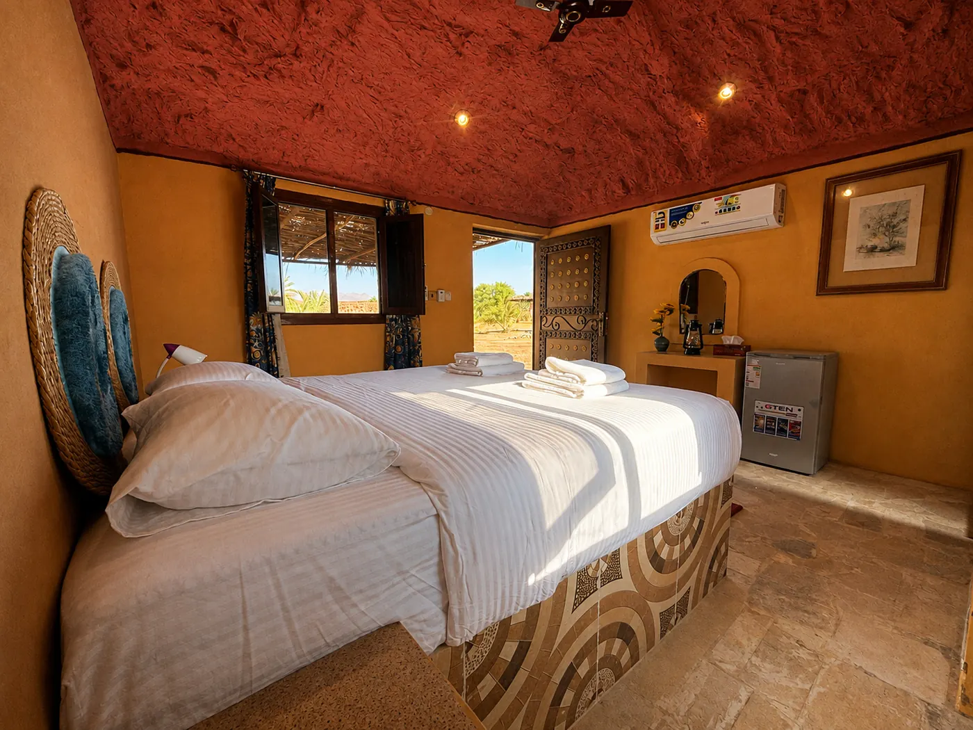 Bed and the door to the shaded porch